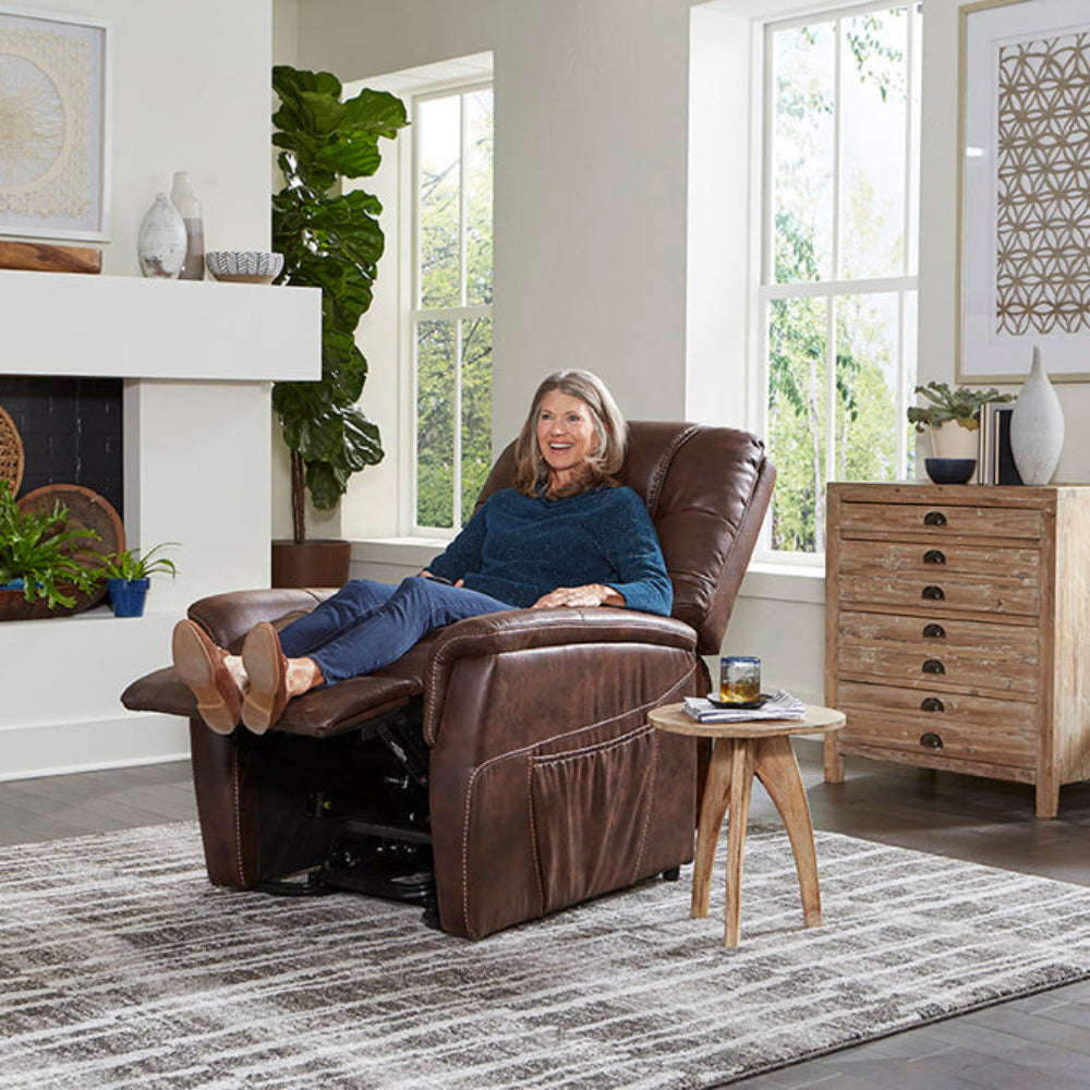 Lifestyle image of a senior woman resting peacefully in the fully reclined Golden Dione PL446 lift chair.